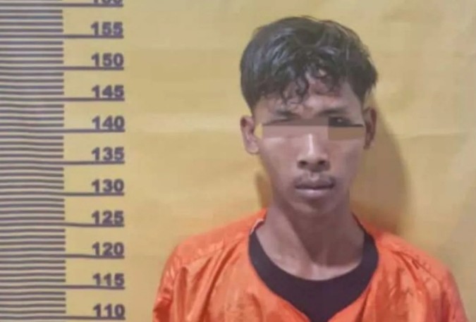 Tersangka RA (20), seorang sales ditangkap Polsek Mandau atas kasus uang palsu (foto/Antara)