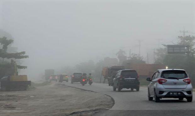 Ilustrasi kabut tebal tutup Kota Pekanbaru (foto/int)