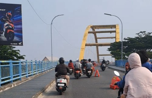 Ilustrasi usai diguyur hujan lebat, warga Pekanbaru berharap kabut asap hilang (foto/Riki)