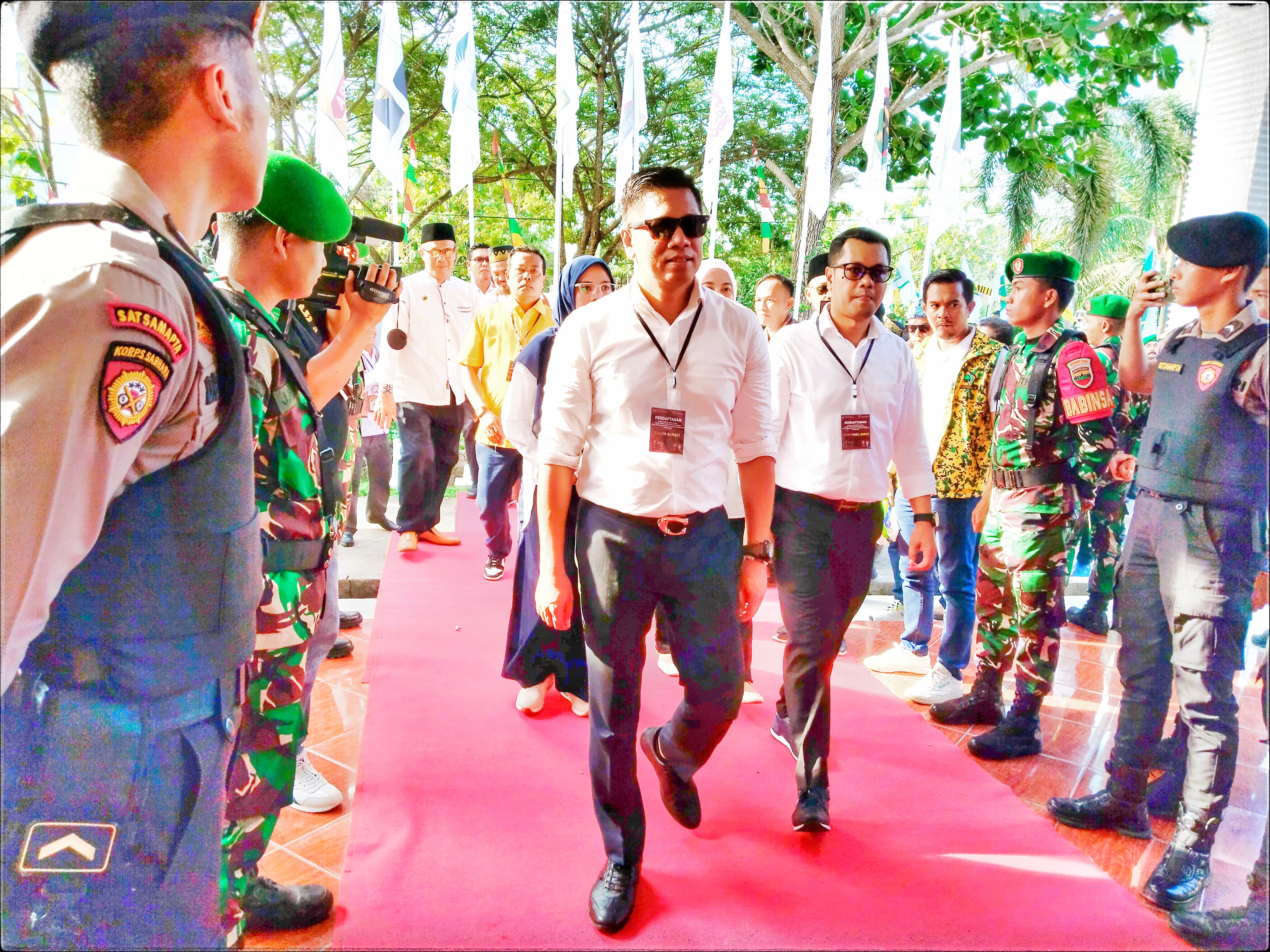 Pasangan calon Bupati dan Wakil Bupati, Mahmuzin Taher dan Iskandar Budiman, secara resmi mendaftar ke KPU