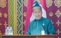 Asisten II Setdaprov Riau, Helmi dalam rapat paripurna dan syukuran HUT ke-27 Kabupaten Pelalawan di Gedung DPRD Pelalawan.(foto: mcr)