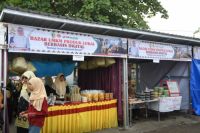 BRK Syariah percepat digitalisasi UMKM di Festival Pacu Jalur 2026 lewat QRIS.(foto: istimewa)